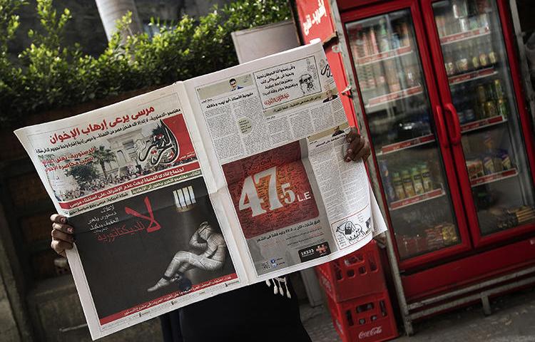 A copy of Egyptian newspaper al-Tahrir is seen in Cairo on December 3, 2012. The newspaper is facing insolvency after its website was blocked in May. (AFP/Gianluigi Guercia)