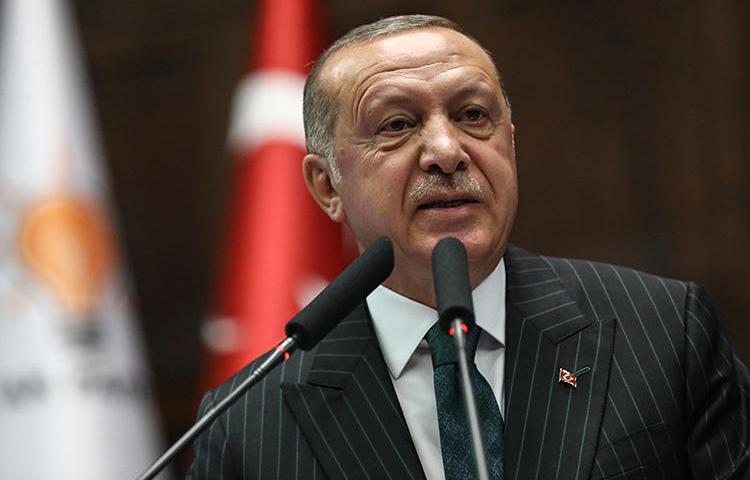 President Recep Tayyip Erdoğan speaks during a parliamentary group meeting at the Grand National Assembly of Turkey in Ankara on June 25, 2019. Two journalists are to stand trial, in separate cases, on charges of insulting the president. (AFP/Adem Altan)