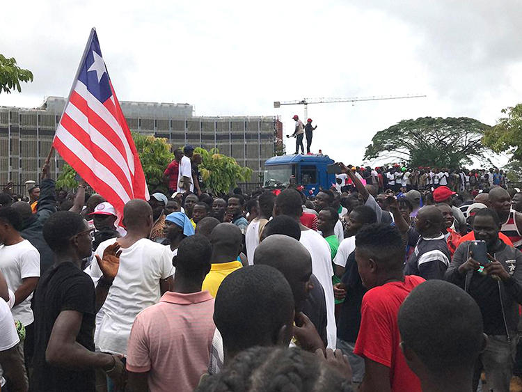 Demonstrators are seen in Monrovia, Liberia, on June 7, 2019. Amid the protests, social media services were disrupted throughout Liberia. (AFP/Carielle Doe)