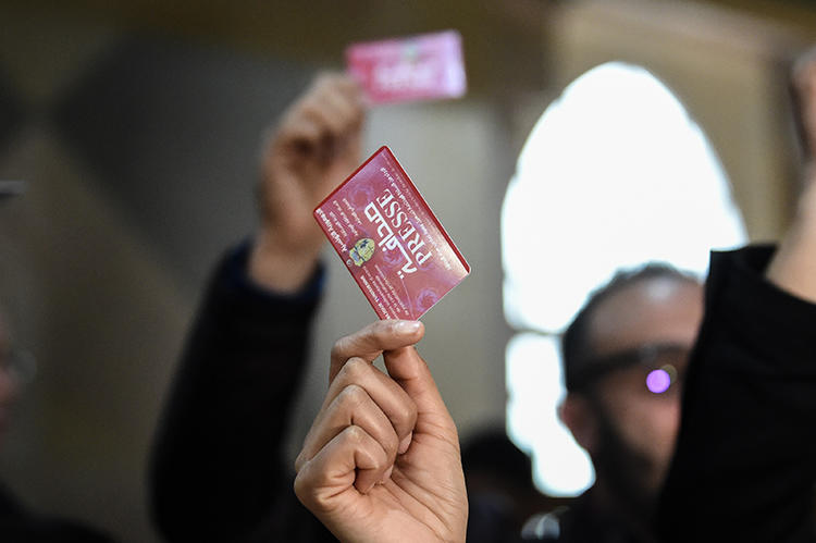 Journalists hold press cards during a protest at the Assembly of the Representatives of the People in Tunis in April 2019. Tunisia has greater press freedom but challenges remain. (AFP/Fethi Belaid)