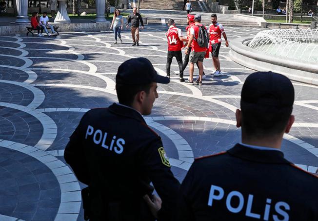 Police officers are seen in Baku, Azerbaijan, on May 29, 2019. Azerbaijani authorities recently jailed two journalists in unrelated cases. (AP/Darko Bandic)