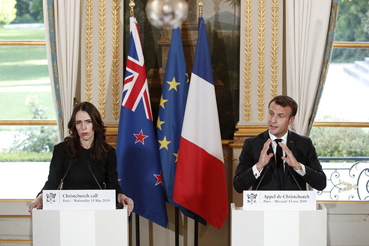 New Zealand Prime Minister Jacinda Ardern, left, and French President Emmanuel Macron hold a press conference at the Elysee Palace in Paris, on May 15, 2019. In the wake of a deadly terror attack in Christchurch, tech regulation in the EU and Australia risks restricting journalism. (Yoan Valat/Pool Photo via AP)