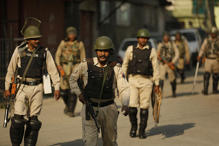 Police are seen in Srinagar, Indian-controlled Jammu and Kashmir, on May 21, 2019. Police in Jammu and Kashmir recently arrested journalist Ghulam Jeelani Qadri. (AP/Mukhtar Khan)