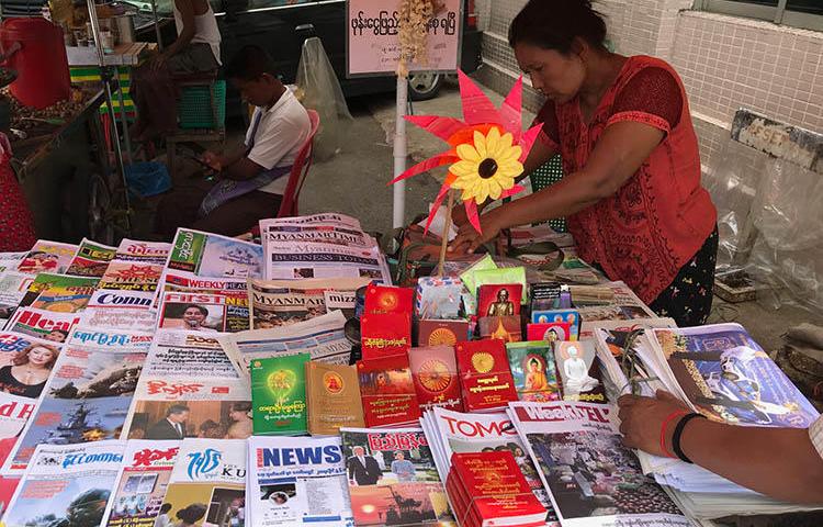 A market stall sells newspapers in Yangon, in June 2019. Journalists in Myanmar say their reporting is still met with legal action and censorship. (CPJ/Shawn Crispin)