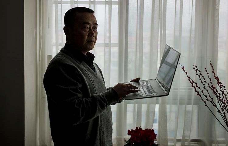 Chinese journalist Huang Qi is seen in Chengdu, Sichuan province, on January 22, 2015. Today, Huang was sentenced to 12 years in prison. (AFP/Fred Dufour)