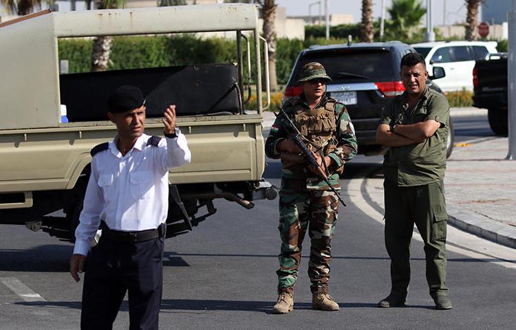 Iraqi Kurdish security officers are seen in Erbil on July 17, 2019. That day, officers from the Kurdish Counter-Terrorism Forces assaulted Al-Jazeera reporter Ahmed al-Zawiti. (AFP/Safin Hamed)