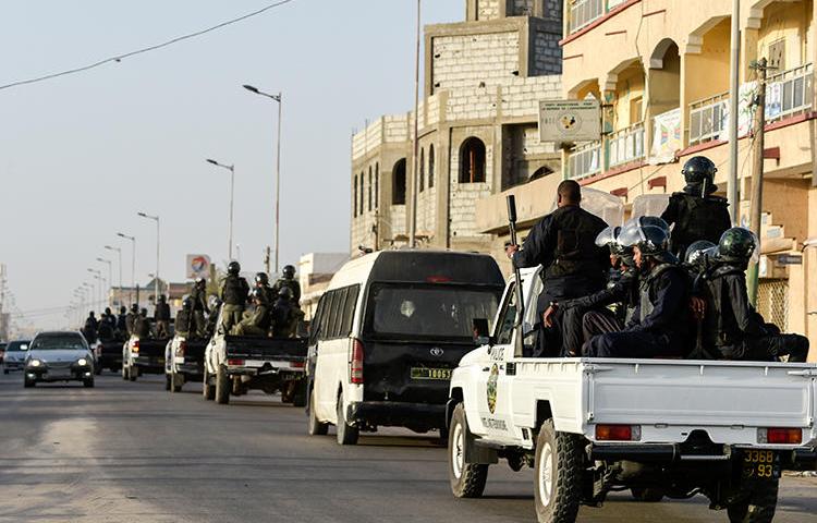 Security forces are seen on June 22 in Nouakchott, Mauritania. Two journalists have been arrested and the internet has been cut throughout the country following elections on June 22. (AFP/Sia Kambou)