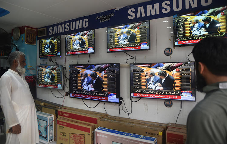Televisions are seen in Karachi, Pakistan, on June 11, 2019. Three TV news channels were recently blocked in the country. (AFP/Asif Hassan)