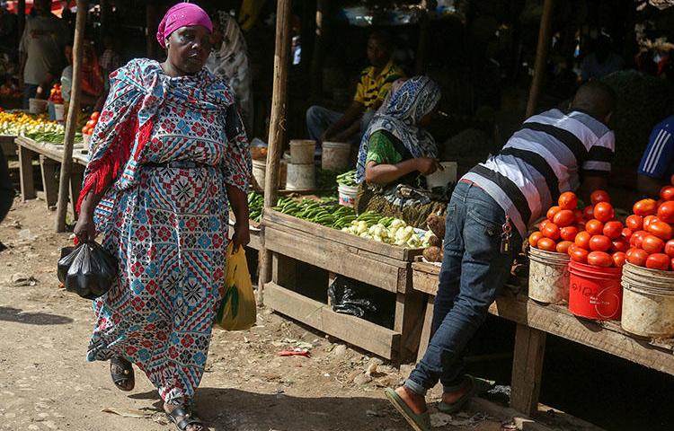 A local market in Dar es Salaam, pictured in May 31. A group of armed men forcefully took an investigative journalist from his home outside the city on July 29. (AFP/Said Khalfan)