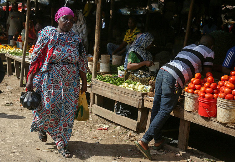 A local market in Dar es Salaam, pictured in May 31. A group of armed men forcefully took an investigative journalist from his home outside the city on July 29. (AFP/Said Khalfan)