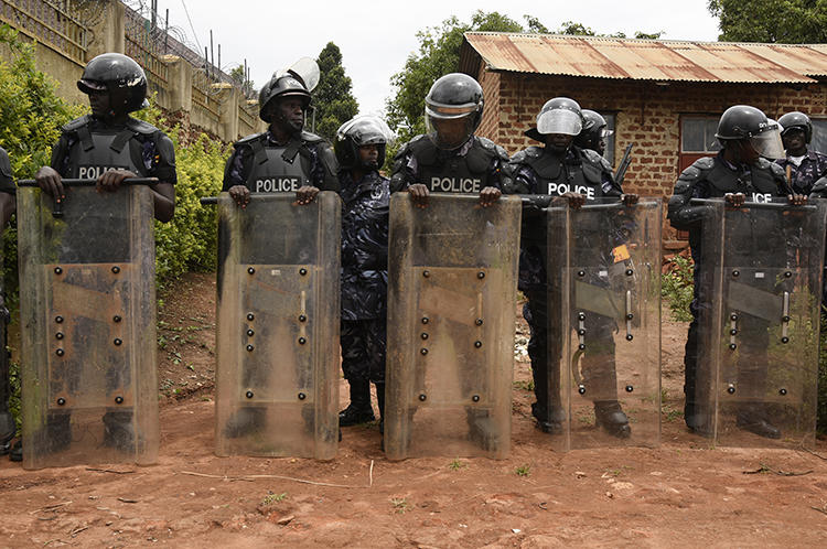 Ugandan police officers are seen in Kampala on April 23, 2019. Police recently arrested Joseph Kabuleta for allegedly posting