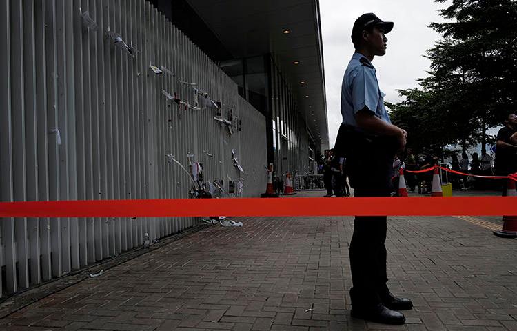 A police officer is seen in Hong Kong on July 2, 2019. On July 1, unidentified assailants vandalized pro-democracy broadcaster Citizens' Radio. (AP/Vincent Yu)