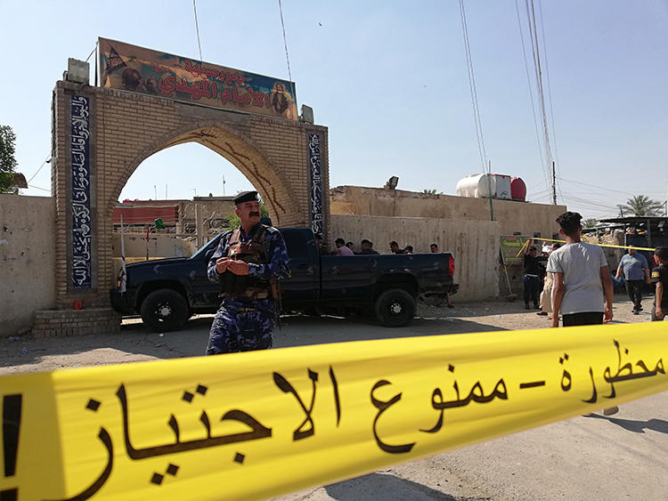Security forces are seen in Baghdad, Iraq, on June 21, 2019. The Baghdad offices of Al-Journal and 7C TV were recently raided in Baghdad following a corruption investigation. (AP/Hadi Mizban)