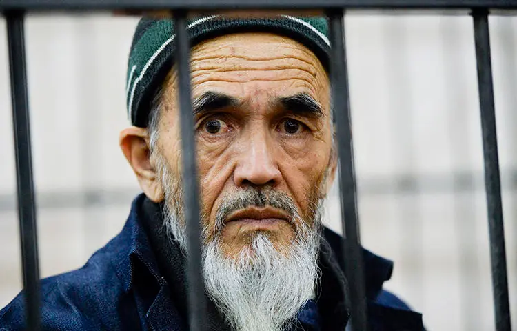 Journalist Azimjon Askarov is seen in a courtroom in Bishkek, Kyrgyzstan, on October 11, 2016. A court today upheld his life sentence in prison. (AP/Vladimir Voronin, file)