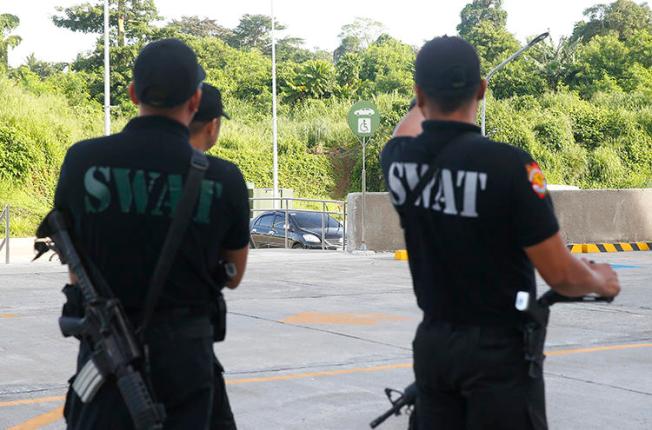 Philippine National Police SWAT members are seen in Tanauan City on July 4, 2018. Radio broadcaster Eduardo Dizon was recently killed in Kidapawan City, in the southern Philippines. (AP/Bullit Marquez)
