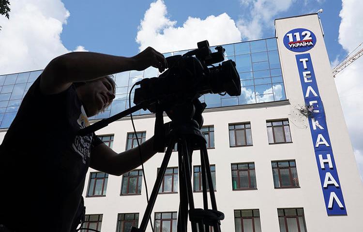 The damaged building of Ukrainian broadcaster 112 Ukraine is seen in Kiev on July 13, 2019. The broadcaster, along with NewsOne, have faced threats and attacks in the run-up to Ukraine's parliamentary elections. (AP/Evgeniy Maloletka)