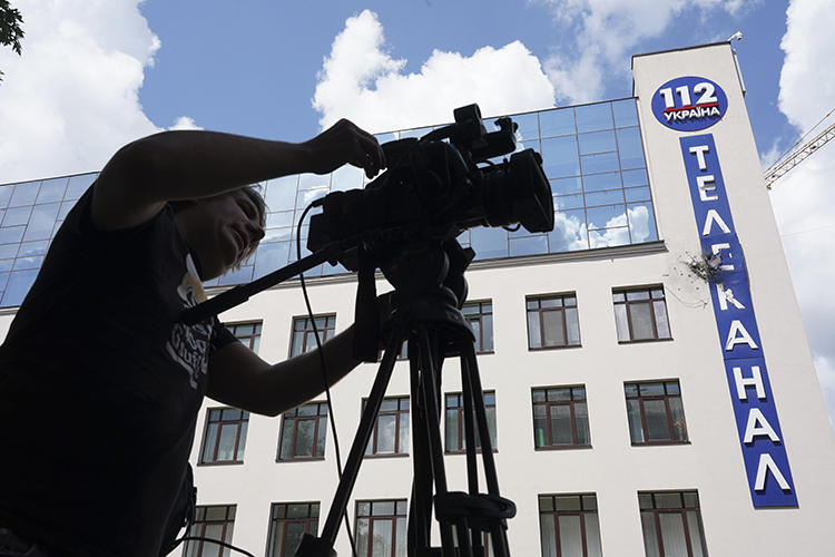 The damaged building of Ukrainian broadcaster 112 Ukraine is seen in Kiev on July 13, 2019. The broadcaster, along with NewsOne, have faced threats and attacks in the run-up to Ukraine's parliamentary elections. (AP/Evgeniy Maloletka)