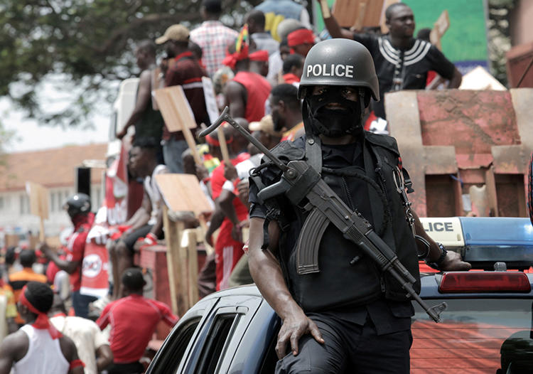 A police officer is seen in Accra, Ghana, on March 28, 2018. Modern Ghana editor Emmanuel Ajarfor and reporter Emmanuel Britwum were recently arrested, and Ajarfor was allegedly tortured by security forces, in Accra. (Reuters/Francis Kokoroko)