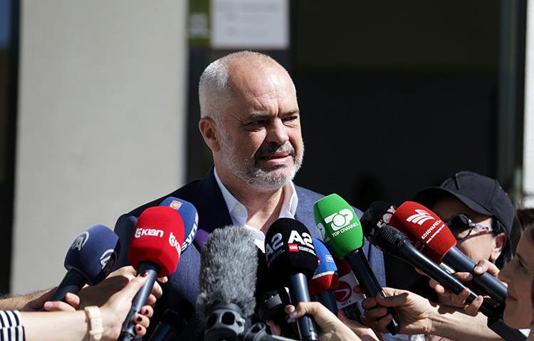 Albania's Prime Minister Edi Rama speaks to the media outside a polling station near Tirana on June 30. A press freedom mission raised several issues with Rama last month, including unresolved attacks on journalists and draconian laws. (Reuters/Florion Goga)