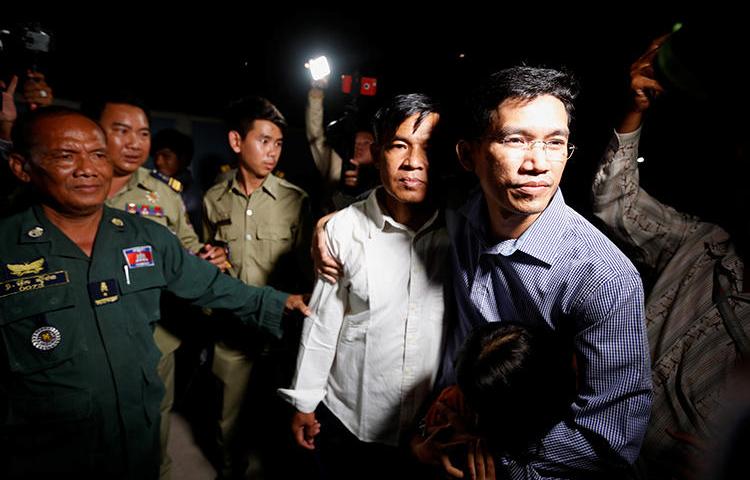 Uon Chhin and Yeang Sothearin, former journalists for Radio Free Asia, are seen in Phnom Penh, Cambodia, on August 21, 2018. The journalists are being tried on espionage charges. (Reuters/Samrang Pring)