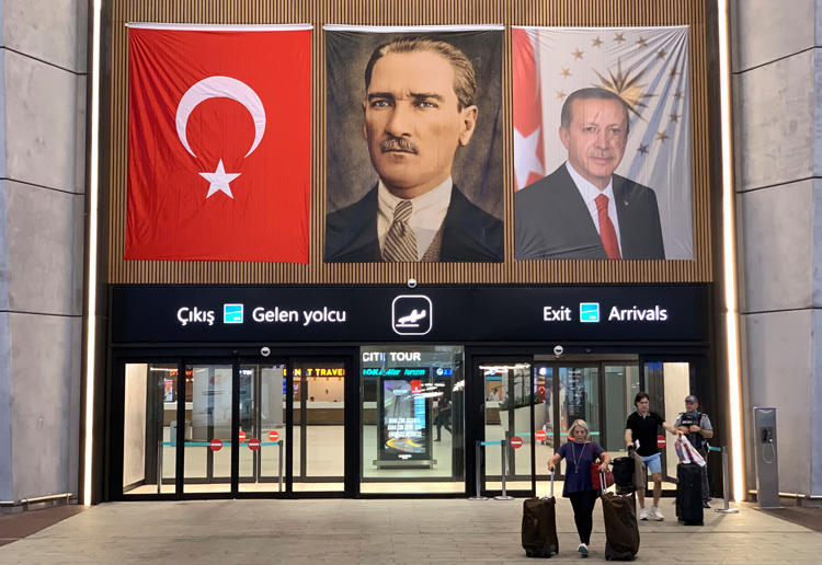 People exit from the international arrivals terminal at the new Istanbul Airport in Istanbul, Turkey, on July 16, 2019. Two documentary filmmakers were sentenced to four and a half years in prison on July 18. (Reuters/Marius Bosch)