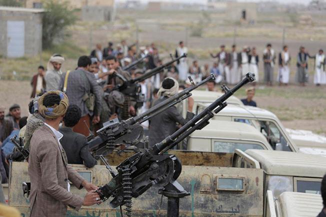 Houthi fighters ride on trucks mounted with weapons during a gathering aimed at mobilizing more fighters for the rebel movement in Sanaa, Yemen, on August 1, 2019. (AP/Hani Mohammed)