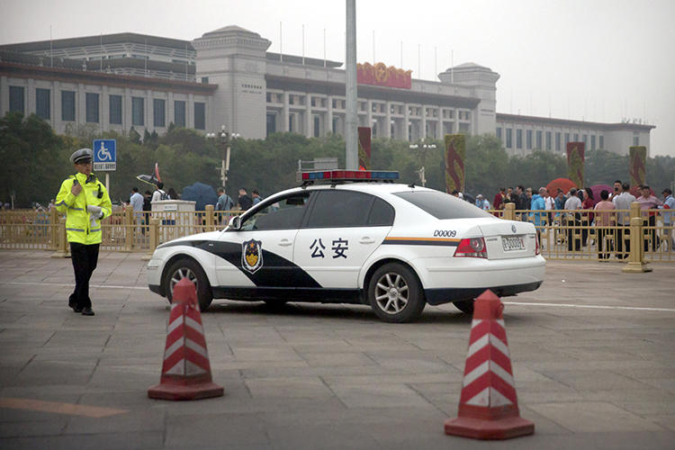 A security official is seen in Beijing on June 4, 2019. Chinese authorities recently announced the formal arrest of blogger Yang Hengjun. (AP/Mark Schiefelbein)