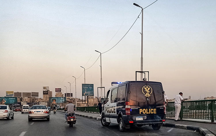 Police officers are seen in Cairo, Egypt, on September 21, 2019. Police recently arrested several journalists covering protests in Cairo and other cities, and authorities blocked news websites and Facebook Messenger. (AFP/Mohamed el-Shahed)