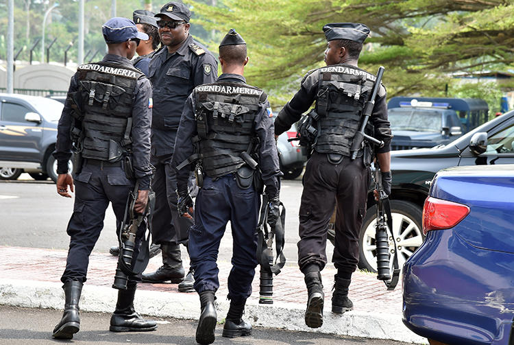 Police forces are seen in Malabo, Equatorial Guinea, on February 3, 2015. Police in Bata recently arrested two journalists and held them for 13 days without charge. (AFP/Issouf Sanogo)