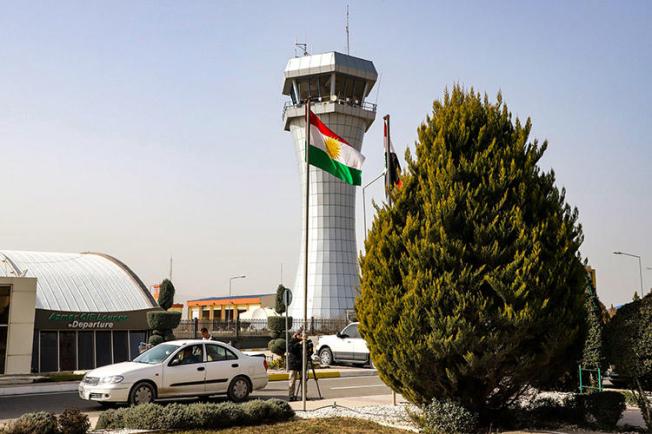 A journalist films outside the Sulaymaniyah International Airport in January 2019. Journalists in Iraqi Kurdistan say disputes between the region's main political parties, the PDK and PUK, leave the press vulnerable. (AFP/Shwan Mohammed)