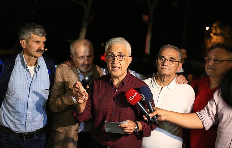 Former staffers of the Turkish daily newspaper Cumhuriyet--cartoonist Musa Kart (C), columnist Guray Oz (L), board member Onder Celik (L2), layers Mustafa Kemal Gungor (R2), and columnist Hakan Kara (R)--speak with journalists after their release near from Kandira prison, in Kandira, Turkey, on September 12, 2019. A joint mission to Turkey found that the press freedom situation remains highly restrictive, despite some room for very cautious optimism. (Stringer/Cumhuriyet Daily Newspaper/AFP)