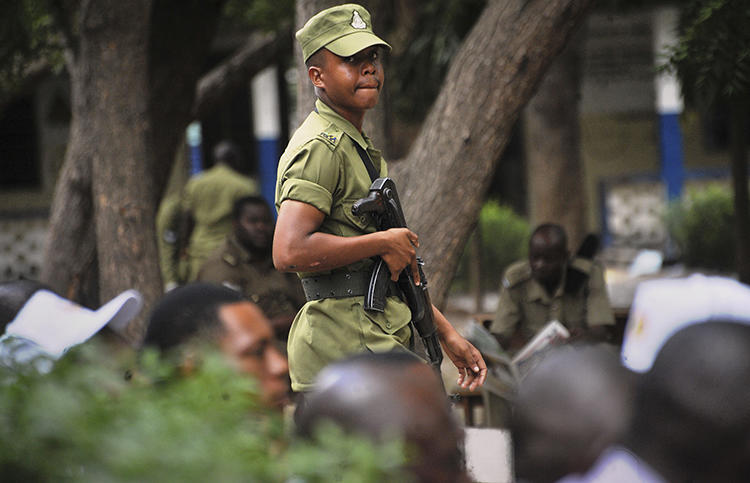 A Tanzanian police officer is seen in Dar es Salaam on October 28, 2015. Tanzanian authorities recently arrested Sebastian Atilio on false news charges. (AP/Khalfan Said)