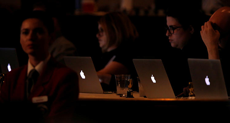 Reporters work during a panel for a television series in Beverly Hills, California, in August 2016. Female and gender non-conforming journalists in the U.S. and Canada say there is a need for greater training on dealing with harassment and threats. (Reuters/Mario Anzuoni)