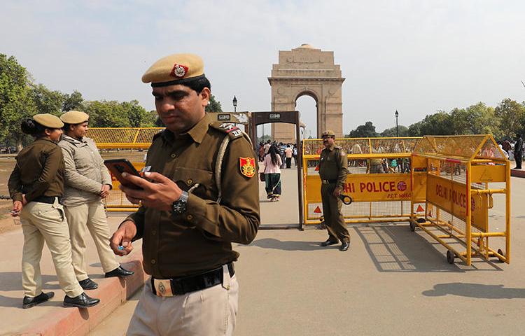 Police are seen in New Delhi, India, on February 27, 2019. Kashmiri journalist Gowhar Geelani was recently barred from leaving the country at a New Delhi airport. (Reuters/Anushree Fadnavis)