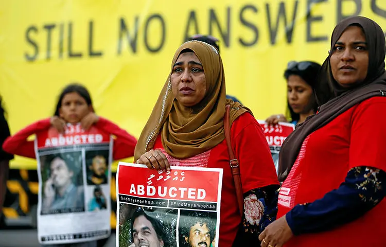 Family members of Maldivian journalist Ahmed Rilwan Abdulla are seen in Colombo, Sri Lanka, on August 28, 2018. A presidential commission in the Maldives recently announced that the journalist was killed in 2014. (Reuters/Dinuka Liyanawatte)