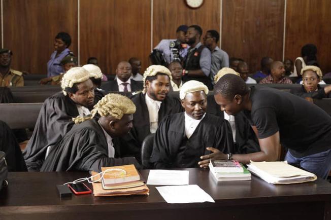 CrossRiverWatch journalist Agba Jalingo (right) is seen in a federal high court in Calabar, Nigeria. Jalingo is due in court tomorrow on amended charges of cybercrime and terrorism. (Oto-Obongo Clement/CrossRiverWatch)