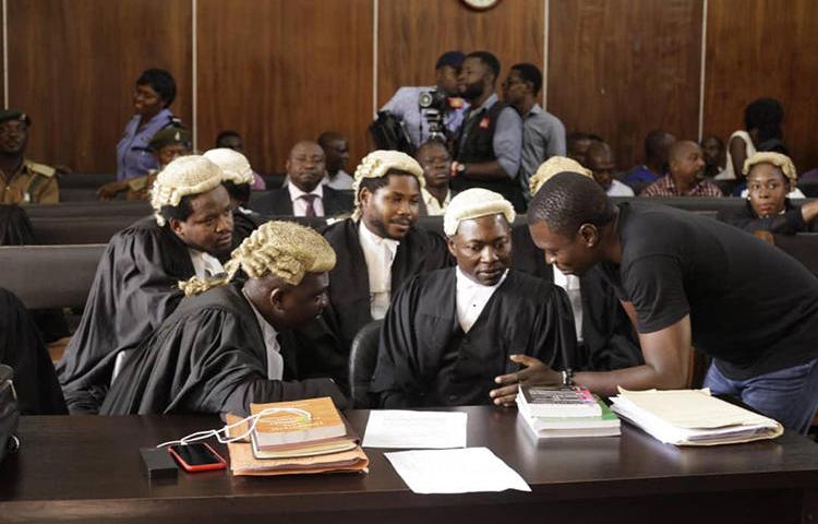 CrossRiverWatch journalist Agba Jalingo (right) is seen in a federal high court in Calabar, Nigeria. Jalingo is due in court tomorrow on amended charges of cybercrime and terrorism. (Oto-Obongo Clement/CrossRiverWatch)
