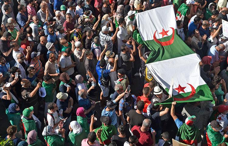 Protesters chant slogans during anti-government demonstrations in Algiers, on October 18, 2019. Police have arrested at least five journalists in recent weeks. (AFP/Ryad Kramdi)