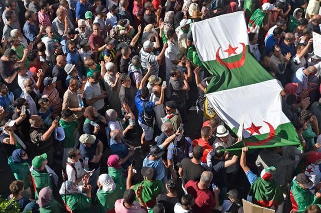 Protesters chant slogans during anti-government demonstrations in Algiers, on October 18, 2019. Police have arrested at least five journalists in recent weeks. (AFP/Ryad Kramdi)