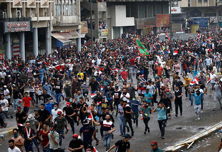 Demonstrators are seen in Baghdad, Iraq, on October 25, 2019. Journalists have been attacked and detained amid the protests. (Reuters/Thaier Al-Sudani)