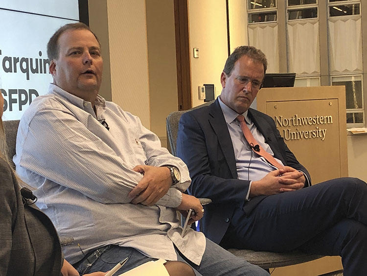 Freelance journalist Bryan Carmody, left, is seen with his attorney, Thomas Burke, at a panel event held by the Society of Professional Journalists in San Francisco on August 13, 2019. Police raided Carmody's home and office in May while investigating the leak of a report on the death of a San Francisco public defender. (AP/Juliet Williams)