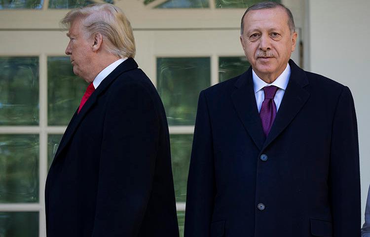 President Donald Trump walks toward the Oval Office after posing for photographers with Turkey's President Recep Tayyip Erdoğan on November 13. Turkey detained at least six journalists in the same week as Erdoğan's visit to the U.S. (AP/Evan Vucci)