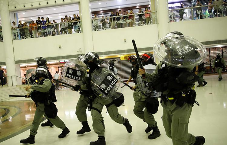 Riot police are seen in Tai Po, Hong Kong, on November 3, 2019. Police recently arrested two journalists amid protests in the city. (Reuters/Ahmad Masood)