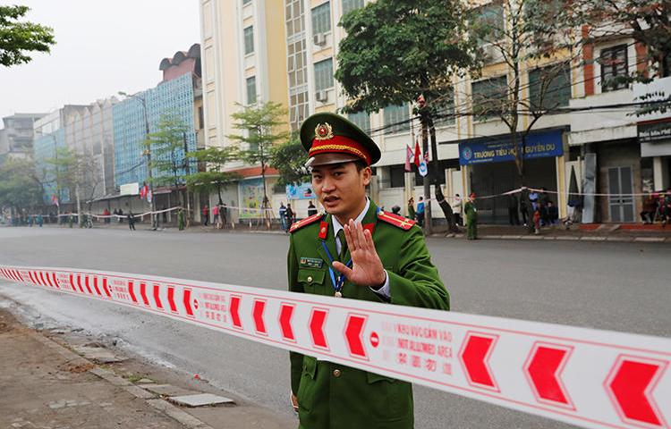 A police officer is seen in Hanoi, Vietnam, on February 26, 2019. Police recently arrested journalist Pham Chi Dung on anti-state charges. (Reuters/Kim Kyung-Hoon)