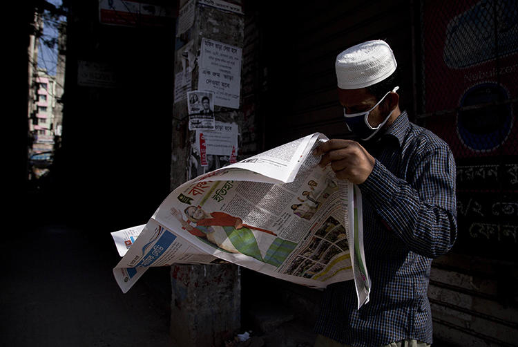 A man reads a newspaper in Dhaka, Bangladesh, on December 31, 2018. Police recently arrested and detained newspaper editor Abdul Asad. (AP/Anupam Nath)