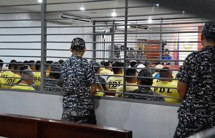 Some of the accused in the 2009 Maguindanao massacre are seen attending the promulgation of the case inside a Taguig City prison, in this December 19, 2019 handout picture. A court today found masterminds Andal Ampatuan Jr., his brother Zaldy Ampatuan, and 26 accomplices guilty of murder for the November 23, 2009 attack that killed 58 people, including 32 journalists and media workers. (Handout via Reuters)