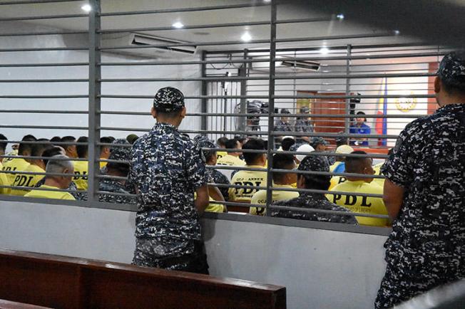 Some of the accused in the 2009 Maguindanao massacre are seen attending the promulgation of the case inside a Taguig City prison, in this December 19, 2019 handout picture. A court today found masterminds Andal Ampatuan Jr., his brother Zaldy Ampatuan, and 26 accomplices guilty of murder for the November 23, 2009 attack that killed 58 people, including 32 journalists and media workers. (Handout via Reuters)