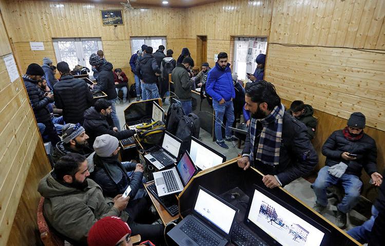 Journalists use the internet inside a government-run media center in Srinagar on January 10, 2020. The Indian Supreme Court today criticized internet restrictions that have obstructed the media for five months. (Reuters/Danish Ismail)