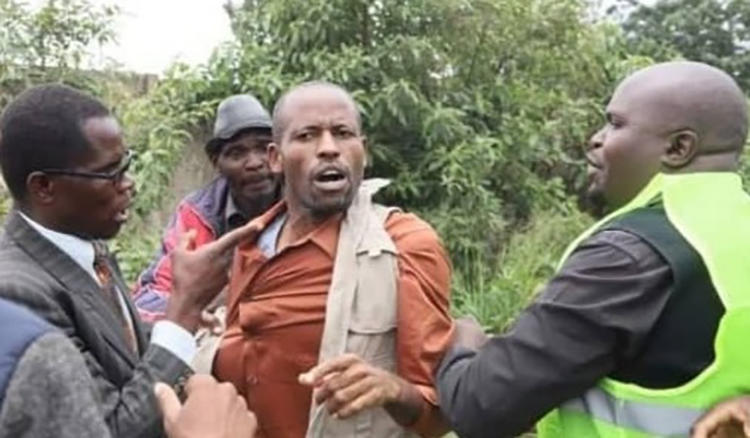 Journalist Robert Tapfumaneyi is seen being shoved by party security personnel at a political event in Harare, Zimbabwe, on January 21, 2020. (Image credit withheld)