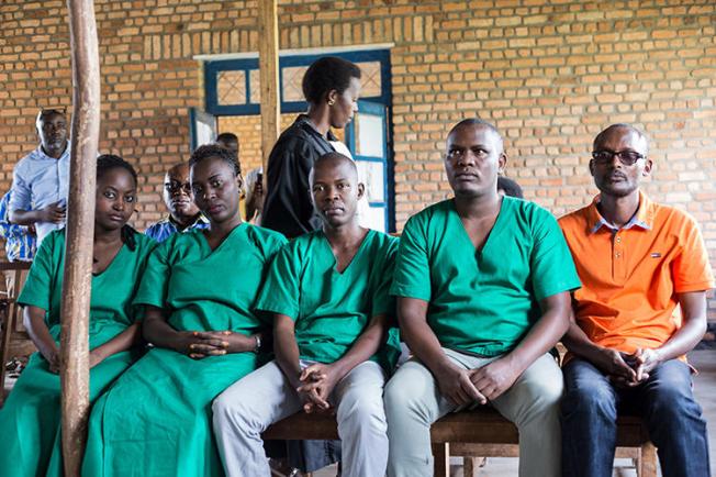 Four Iwacu journalists, (L to R) Agnes Ndirubusa, Christine Kamikazi, Egide Harerimana, Terence Mpozenzi, and the driver Adolphe Masabarakiza, appear at the High Court in Bubanza, western Burundi, on December 30, 2019. The court today convicted the journalists on state security charges. (AFP/Tchandrou Nitanga)